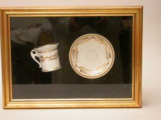 Cup and saucer in shadow box
