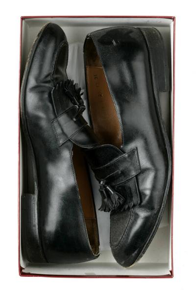 Pair of men's shoes with shoe bags