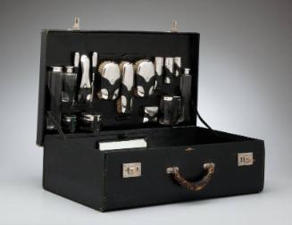 Dressing case with silver-mounted fittings