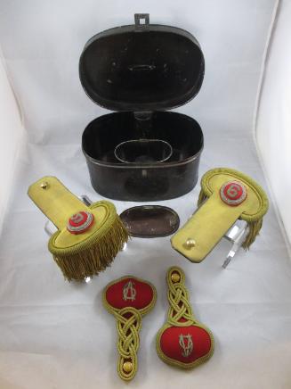 Epaulets and shoulder knots in storage box