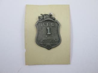 Badge: H.F.D. 1
