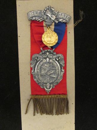 Badge: 26th Annual Conv. Firemen's Assn...Aug. 16-19, 1898