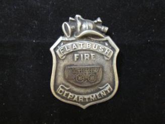 Badge on block in envelope: Flatbush Fire Department