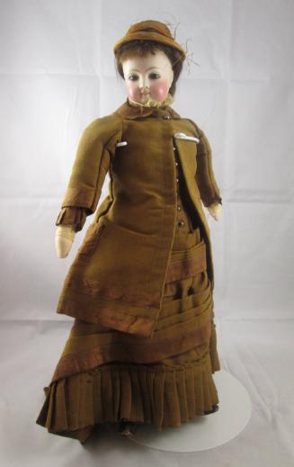 Doll: in brown hat and coat