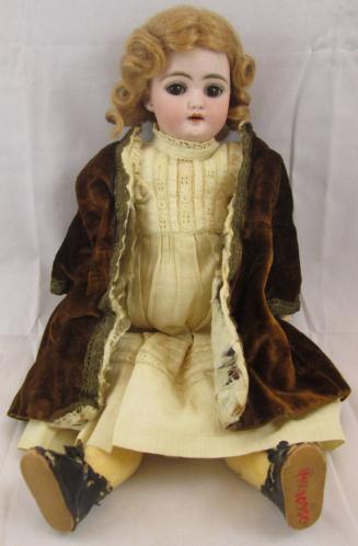 Doll in velvet coat
