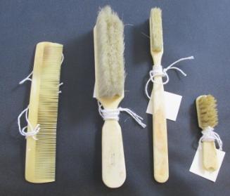 Collection of (3) brushes and a comb