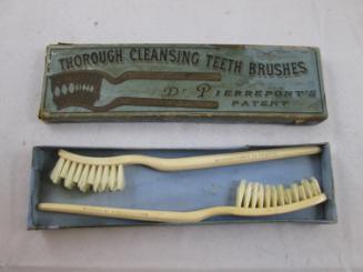 Tooth brushes (2) and a box
