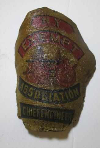 Fire helmet frontpiece: N.Y. Exempt Assn. chief engineer