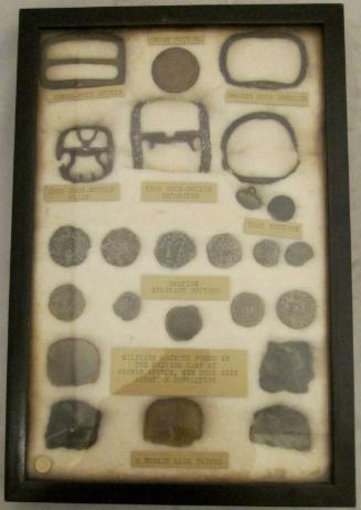 Framed set of objects (24) excavated at a British Revolutionary War camp
