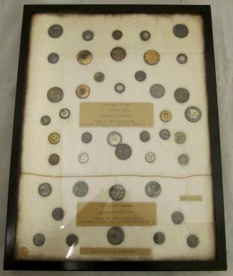 Framed set of buttons (43) excavated at Fort Haldimand