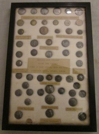 Framed set of British military buttons (51) excavated at a British fort