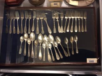 Framed spoons (15) and forks (21) from Hudson River steamboats