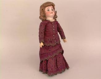 Doll: on stand w/purple dress
