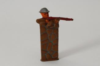Soldier firing behind wall