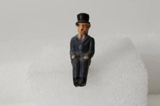 Seated man in top hat