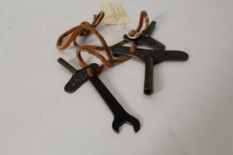 Clockwork keys and wrench on cord