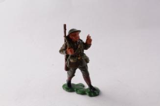 British infantryman advancing while smoking cigarette
