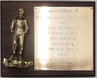 Plaque presented to the Women's Sports Foundation by Afrika King