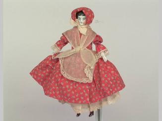 Doll: woman in orange bonnet and dress