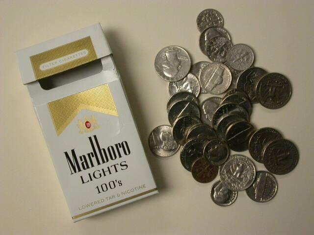 Cigarette box filled with change
