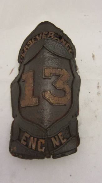 Fire helmet frontpiece: perserverance 13 engine
