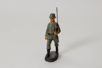 German soldier marching with rifle
