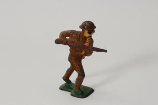 Advancing soldier with gas mask