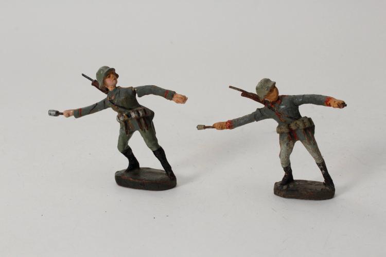WWI German soldier throwing stick grenade