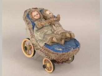 Dolls in carriage