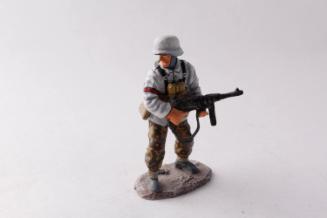 WWII German Army Waffen SS winter soldier advancing with automatic weapon